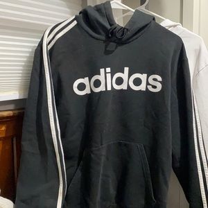 Black Adidas hoodie with stripes on sleeves